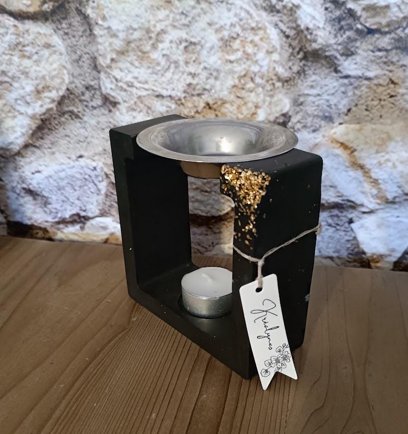 Brûle parfum carré noir et or.